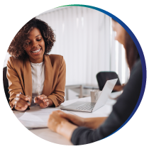 Woman discussing documents with a client Woman discussing documents with a client