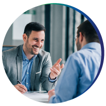 Business man talking to man in a business setting Business man talking to man in a business setting